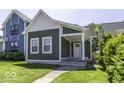 Charming single-Gathering home features new siding, white trim, and a welcoming front porch at 337 E Minnesota St, Indianapolis, IN 46225