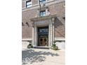 Close up on the ornate, stone-trimmed entrance featuring an inviting doorway and classic architectural details at 350 N Meridian St # 205, Indianapolis, IN 46204