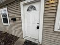 Close-up of the white front door with decorative window, mail box, and house number at 3519 N Whitcomb Ave, Indianapolis, IN 46224
