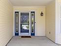Welcoming front entryway with a glass storm door and exterior light fixture at 3856 Cornwallis Ln, Carmel, IN 46032