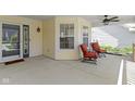 Relaxing porch featuring outdoor seating and a ceiling fan at 3856 Cornwallis Ln, Carmel, IN 46032