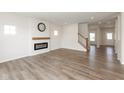 Bright living room featuring hardwood floors, a modern fireplace, and plenty of natural light at 4016 Railhead Ave, Westfield, IN 46074