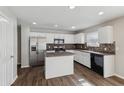 Modern kitchen features stainless steel appliances and a center island at 4747 Summit Lake Pl, Indianapolis, IN 46239