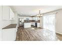 Open kitchen with stainless steel appliances and hardwood floors at 4747 Summit Lake Pl, Indianapolis, IN 46239