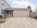 Attached two-car garage featuring a wide driveway and easy access to the home's rear entrance at 645 N Ritter Ave, Indianapolis, IN 46219
