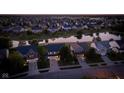 Picturesque aerial view of a residential neighborhood with pond and well-maintained homes at 8650 N Springview Dr, McCordsville, IN 46055