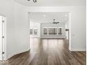 Spacious living room boasting an open floor plan, hardwood flooring, and abundant natural light at 11172 Cliffside Dr, Fortville, IN 46040