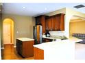 Stylish kitchen with stainless steel appliances, breakfast bar, and wood flooring at 1630 Valdarno Dr, Greenwood, IN 46143