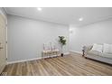 Inviting living room featuring new wood flooring and neutral paint tones with light colored furniture at 3407 Allison Ave, Indianapolis, IN 46224