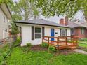 Exterior view of house highlighting the home's side yard at 3559 Carrollton Ave, Indianapolis, IN 46205
