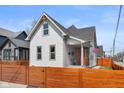 Charming two-story home featuring a well-manicured lawn and inviting front porch, enclosed by a modern fence at 358 Terrace Ave, Indianapolis, IN 46225