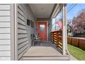 Welcoming porch featuring seating, an American flag, and a view of the neighborhood at 358 Terrace Ave, Indianapolis, IN 46225