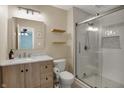 This bathroom features new shelving, vanity, and a glass door shower at 4345 Elkhorn Dr, Westfield, IN 46062