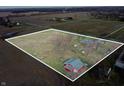 Aerial view of property showcasing large lot with home and a red barn with clear boundary lines at 4611 E Us Highway 36, Markleville, IN 46056
