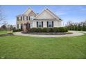 Beautiful two-story home with a well-manicured lawn and curved walkway leading to the front door at 4733 Mecklenburg Dr, Plainfield, IN 46168