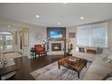 Inviting living room features a stone fireplace, plush seating, and ample natural light at 4733 Mecklenburg Dr, Plainfield, IN 46168