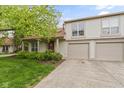 Inviting two-story home features a well-maintained lawn, beautiful greenery, and attached two car garage at 6404 Bayside Ct, Indianapolis, IN 46250