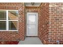 Close up of the front door and brick facade of the house at 6524 Turf Way, Anderson, IN 46013