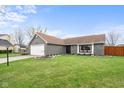 Beautifully landscaped front yard with a well-kept lawn and inviting curb appeal at 7813 Ashton Pl, Fishers, IN 46038