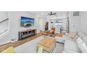 Stylish living room showcases an open layout, ceiling fan, hardwood floors, and comfortable seating at 801 Bates St, Indianapolis, IN 46202