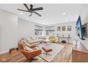 Spacious living area features hardwood floors, large windows, and cozy seating arrangement at 801 Bates St, Indianapolis, IN 46202