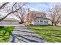Traditional home featuring a long driveway and well-maintained landscaping, plus detached three car garage at 1325 Fordice Rd, Lebanon, IN 46052