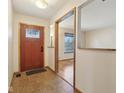 Welcoming foyer featuring tile flooring and a decorative front door at 1422 N Trillium Ct, Indianapolis, IN 46219