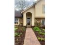 Inviting front entrance with a brick pathway and manicured garden at 1813 Birch Dr, Plainfield, IN 46168