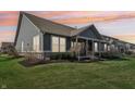 The manicured lawn surrounds the house with an unobstructed view of the backyard at 1972 Mobley Dr, Westfield, IN 46074