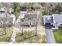A bird's-eye view showcases the property's mature trees, surrounding neighborhood, and charming curb appeal at 25 W 59Th St, Indianapolis, IN 46208