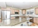 Spacious kitchen featuring granite countertops, stainless steel appliances, and ample cabinet space at 25 W 59Th St, Indianapolis, IN 46208