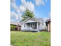 Charming home featuring a welcoming front porch with seating and well-maintained landscaping at 2737 Napoleon St, Indianapolis, IN 46203
