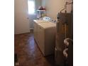 Practical laundry room with washer, dryer, and hot water heater at 351 N Smart St, Greenwood, IN 46142