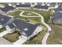 An aerial view of the community showcasing a walking path, a gazebo, and well maintained lawns at 4179 Hume Ave, Plainfield, IN 46168