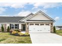Charming home with stone accents, manicured lawn, and a two-car garage, blending curb appeal with functionality at 4179 Hume Ave, Plainfield, IN 46168