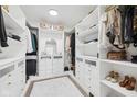Spacious walk-in closet with custom shelving, drawers, and a plush white rug at 431 W Main St, Lizton, IN 46149