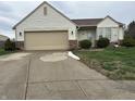 Charming single-story home with vinyl siding, attached garage, and well-maintained landscaping at 4320 Lucky Ct, Indianapolis, IN 46203