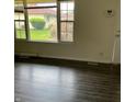 Bright living room featuring expansive windows and contemporary flooring at 8345 Paso Del Norte Ct, Indianapolis, IN 46227