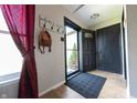 Welcoming entryway with tiled floor and a convenient coat rack at 839 Bough St, Whiteland, IN 46184