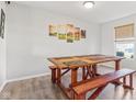 Bright dining room with a rustic wooden table and bench seating, perfect for Gathering meals at 951 Brookstone Dr, Franklin, IN 46131