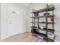 Inviting entryway featuring wood-look floors and stylish shelving for storage and decor at 951 Brookstone Dr, Franklin, IN 46131