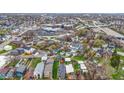 A bird's eye view of a neighborhood featuring a charming blue home with dual decks at 953 Harrison St, Indianapolis, IN 46202