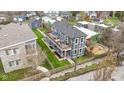 Detailed aerial view of two-story home featuring lush landscaping and backyard patio at 953 Harrison St, Indianapolis, IN 46202