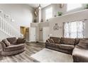 Spacious living room featuring soaring ceilings, neutral paint, and cozy seating at 11124 Deer Valley Dr, Indianapolis, IN 46229