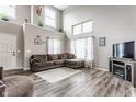 Spacious living room with soaring ceilings, cozy seating, and a decorative entertainment center at 11124 Deer Valley Dr, Indianapolis, IN 46229