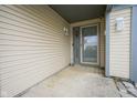 Covered front porch with vinyl siding and storm door offers a welcoming entrance at 1163 Randall Way, Brownsburg, IN 46112