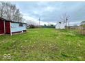 Large backyard with lots of space and a few outbuildings in need of repair at 1237 N Sheffield Ave, Indianapolis, IN 46222