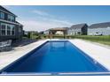 Backyard pool with gazebo, patio area and black aluminum fence at 12988 Fernie Cir, Fishers, IN 46037