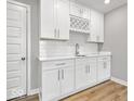 Modern kitchen with white cabinets, stylish fixtures, and ample counter space at 13833 Tender Dr, Carmel, IN 46032