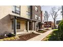 Townhomes featuring modern exteriors with sidewalks and small front yard landscaping at 1811 Livery Way, Indianapolis, IN 46202
